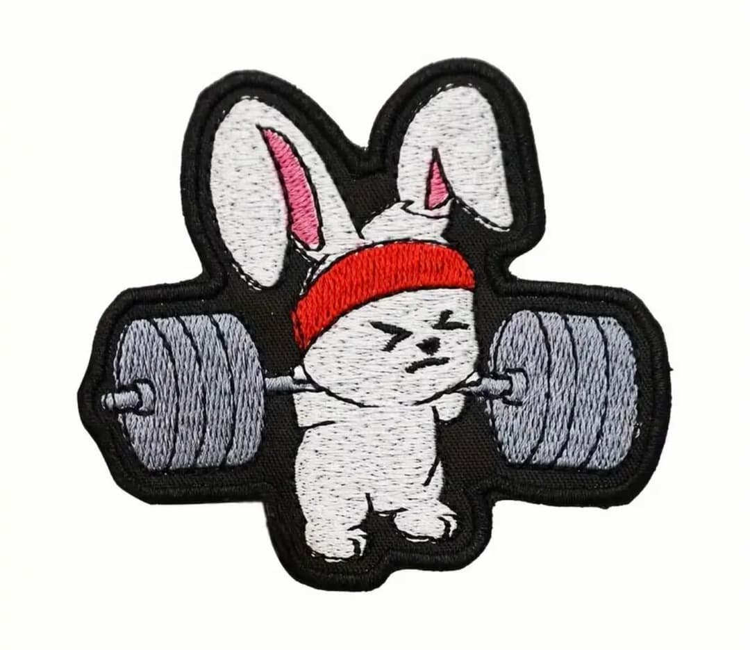 Klettverschluss mit Motiv „Hase als Gewichtheber“